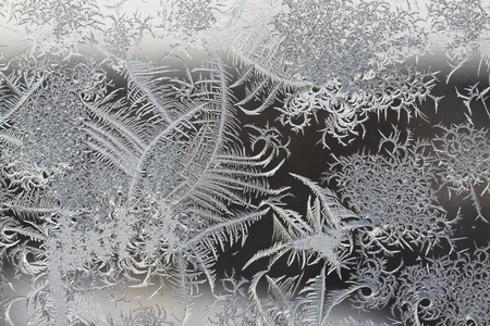 The abstract frosty pattern on glassの写真素材