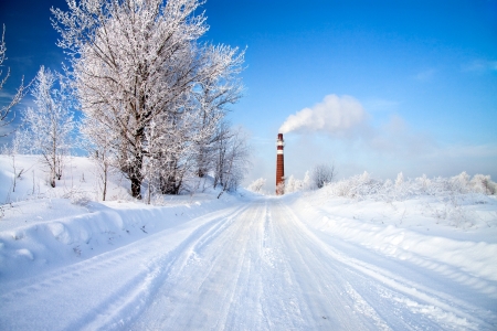 beautiful winter day and industrial air pollutionの写真素材