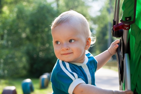 the beautiful small child in park on walkの写真素材