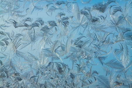 abstract background from frosty pattern on glassの写真素材