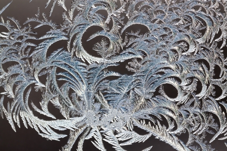abstract background from frosty pattern on glassの写真素材