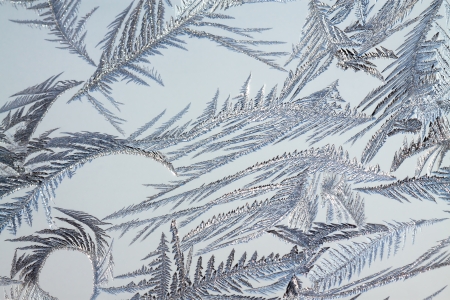 abstract background from frosty pattern on glassの写真素材