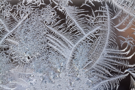 abstract background from frosty pattern on glassの写真素材