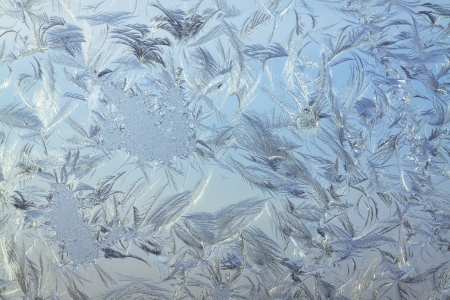 abstract background from frosty pattern on glassの写真素材