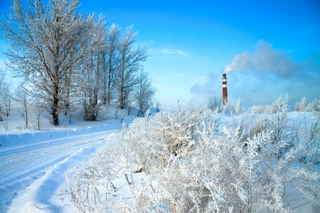 beautiful winter day and industrial air pollutionの写真素材
