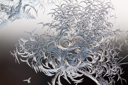abstract background from frosty pattern on glassの写真素材