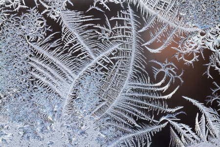 abstract background from frosty pattern on glassの写真素材