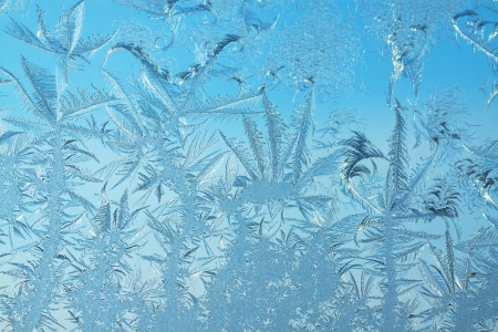 abstract background from frosty pattern on glassの写真素材