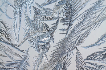 abstract background from frosty pattern on glassの写真素材