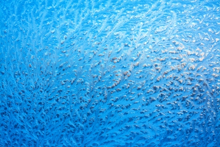 abstract background from frosty pattern on glassの写真素材