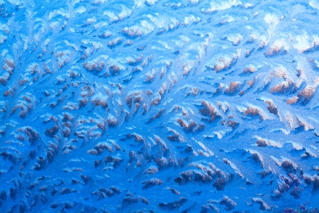 abstract background from frosty pattern on glassの写真素材