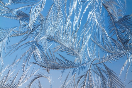abstract background from frosty pattern on glassの写真素材
