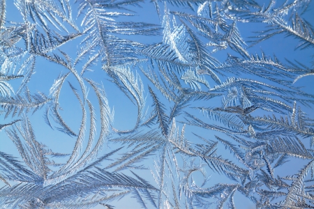 abstract background from frosty pattern on glassの写真素材
