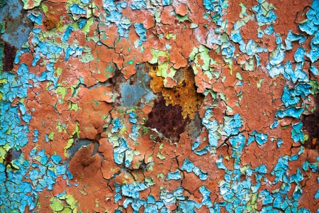 old abstract background from the cracked paint on rusty ironの写真素材