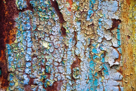 old abstract background from the cracked paint on rusty ironの写真素材