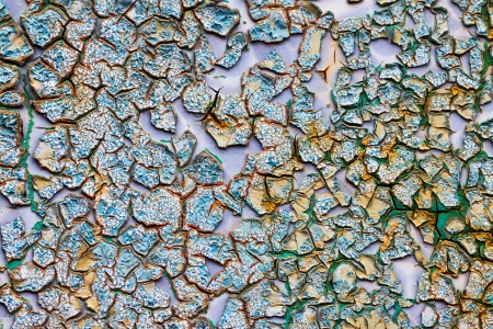 old abstract background from the cracked paint on rusty ironの写真素材
