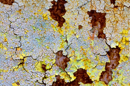 old abstract background from the cracked paint on rusty ironの写真素材