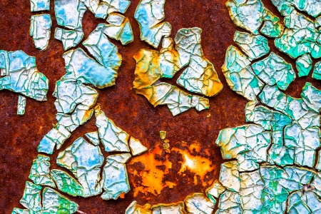 old abstract background from the cracked paint on rusty ironの写真素材