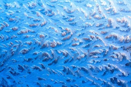 abstract background from frosty pattern on glassの写真素材