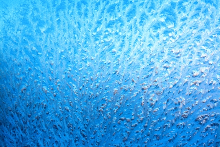 abstract background from frosty pattern on glassの写真素材