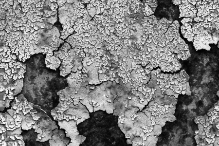 old abstract background from the cracked paint on rusty ironの写真素材