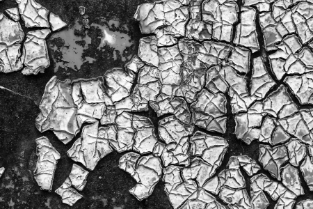 old abstract background from the cracked paint on rusty ironの写真素材
