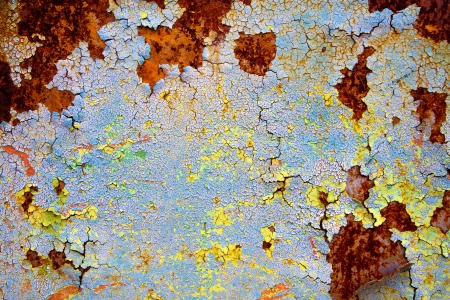 old abstract background from the cracked paint on rusty ironの写真素材