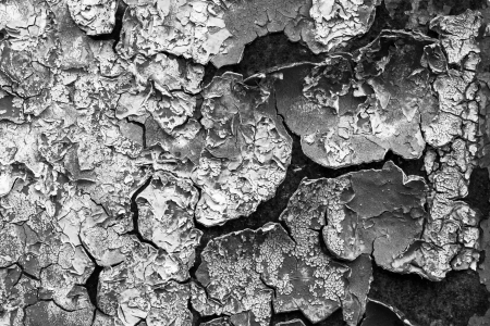 old abstract background from the cracked paint on rusty ironの写真素材