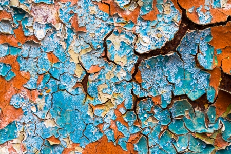 old abstract background from the cracked paint on rusty ironの写真素材