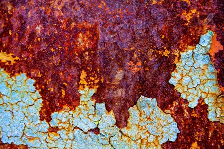 old abstract background from the cracked paint on rusty ironの写真素材