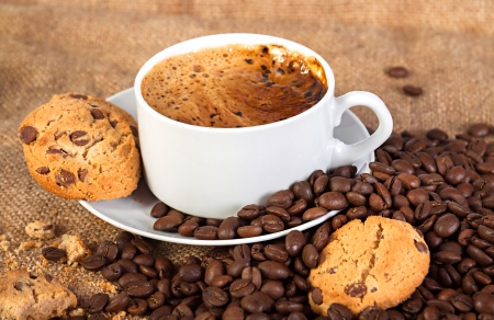 cup with hot coffee and cookiesの写真素材