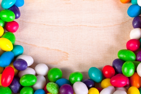 frame  a background from colorful sweets of sugar candiesの写真素材