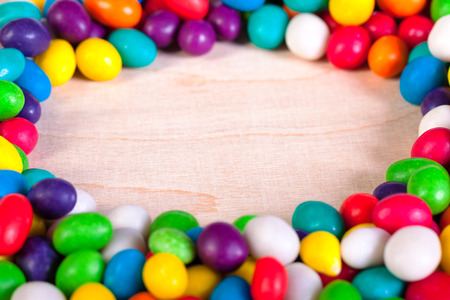 frame  a background from colorful sweets of sugar candiesの写真素材