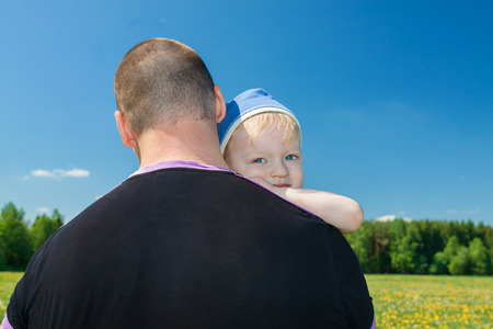 the small child with the father on walk in parkの写真素材