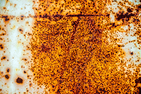 old abstract background from the cracked paint on rusty iron