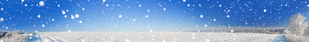 rural winter landscape panorama with a field, snow, forest, city and blue sky. a frosty clear day. panoramic viewの写真素材