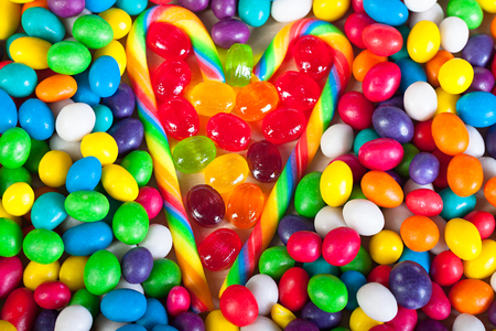 frame from heart from colorful sweets of sugar candies. background from on candies. colored sweets close upの写真素材