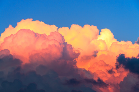 beautiful summer landscape with blue sky and cumulus clouds at sunset. abstract backgroundの写真素材