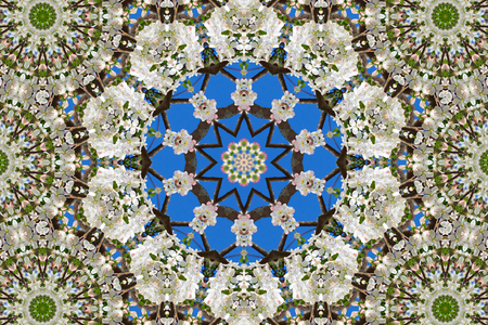 abstract background of floral pattern of a kaleidoscope. white blue green background fractal mandala. abstract kaleidoscopic arabesque. geometrical ornament flower patternの写真素材