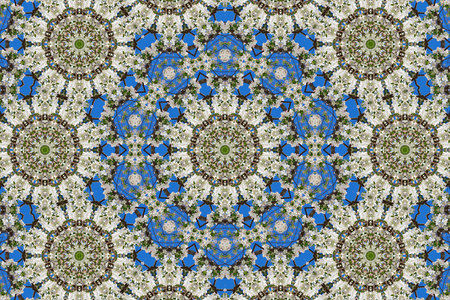 abstract background of floral pattern of a kaleidoscope. white blue green background fractal mandala. abstract kaleidoscopic arabesque. geometrical ornament flower patternの写真素材