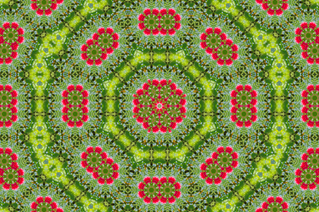 abstract background of floral pattern of a kaleidoscope. pink blue green background fractal mandala. abstract kaleidoscopic arabesque. geometrical ornament flower patternの写真素材