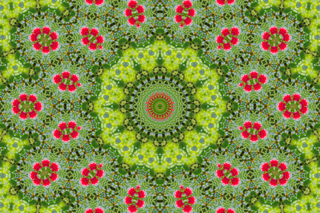 abstract background of floral pattern of a kaleidoscope. pink blue green background fractal mandala. abstract kaleidoscopic arabesque. geometrical ornament flower patternの写真素材