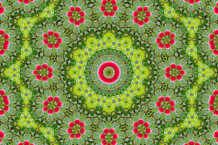 abstract background of floral pattern of a kaleidoscope. pink blue green background fractal mandala. abstract kaleidoscopic arabesque. geometrical ornament flower patternの写真素材