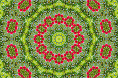 abstract background of floral pattern of a kaleidoscope. pink blue green background fractal mandala. abstract kaleidoscopic arabesque. geometrical ornament flower patternの写真素材