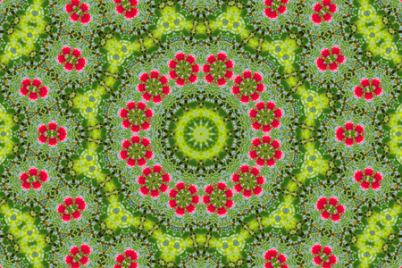 abstract background of floral pattern of a kaleidoscope. pink blue green background fractal mandala. abstract kaleidoscopic arabesque. geometrical ornament flower patternの写真素材