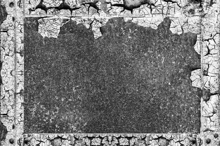 old abstract background from cracked paint on rusty iron. empty vintage frame of cracked paint on metal rust. black and white grunge texture design elementの写真素材