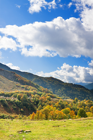 beautiful mountain landscape with blue sky and white clouds. rocky autumn scenery scenic viewの写真素材
