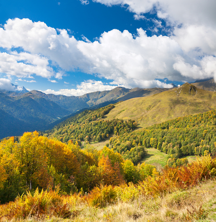 beautiful panorama mountain landscape with blue sky and white clouds. rocky autumn scenery scenic panoramic viewの写真素材