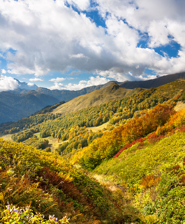 beautiful panorama mountain landscape with blue sky and white clouds. rocky autumn scenery scenic panoramic viewの写真素材