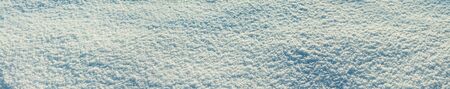 abstract blue white background of snow close up. winter panorama texture of  snow. panoramic snowy viewの写真素材